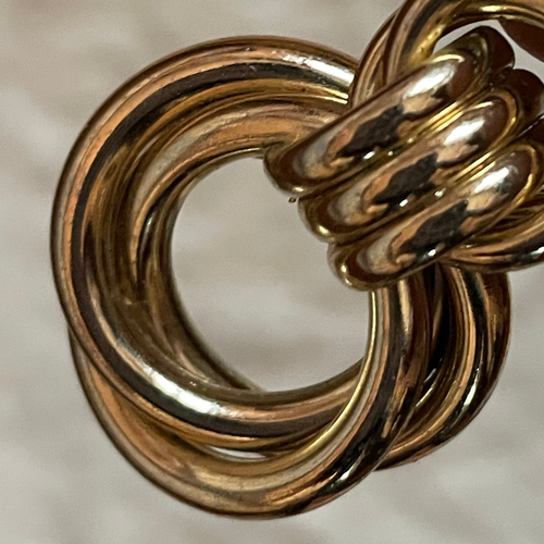 Boucle d'oreille double anneaux enlacés